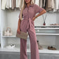 Dames-jumpsuit met knoopsluiting en strikceintuur in de taille