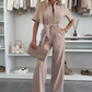 Dames-jumpsuit met knoopsluiting en strikceintuur in de taille