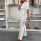Dames-jumpsuit met knoopsluiting en strikceintuur in de taille