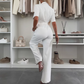 Dames-jumpsuit met knoopsluiting en strikceintuur in de taille