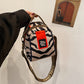 Dames schoudertas met modieuze print